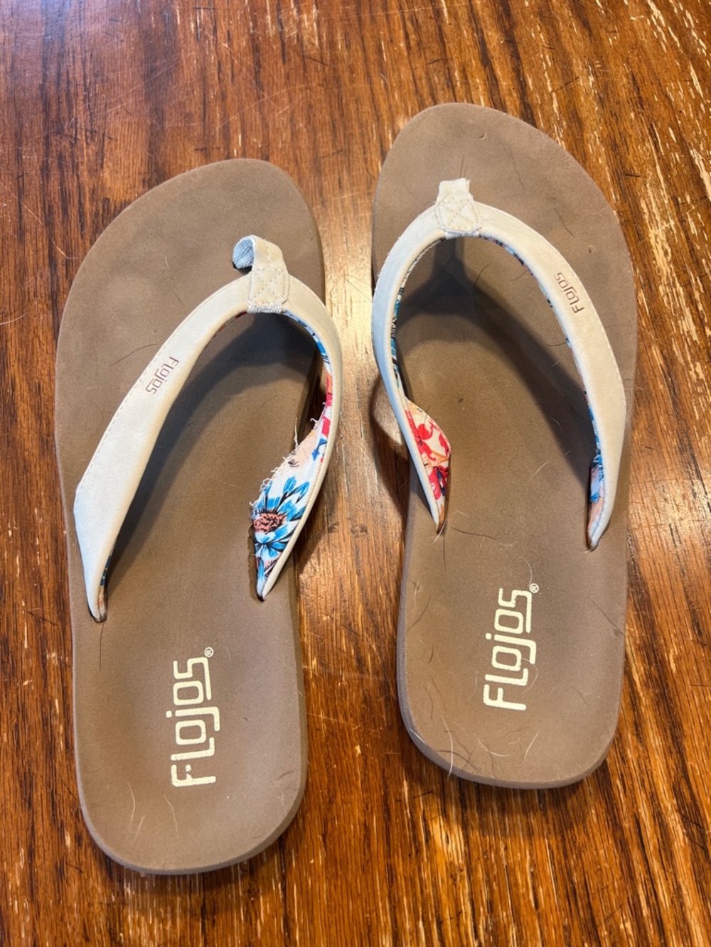 Flojos Brown Footbed Flip Flops with Beige Straps and Floral Accent
